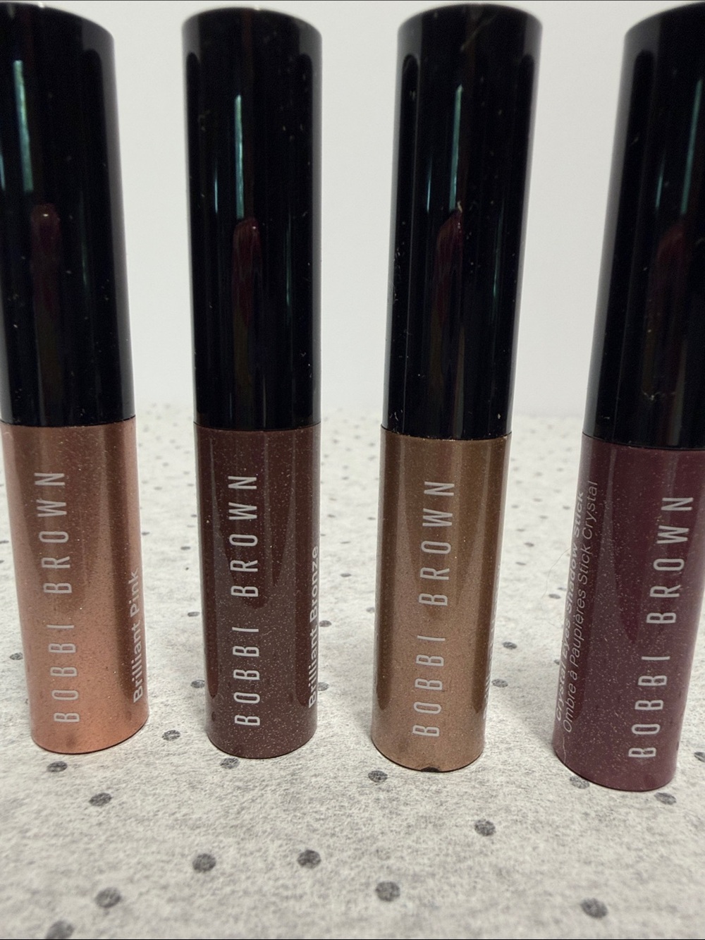 4 Bobbi Brown crystal eye shadow sticks, brilliant bronze, pink, violet, honey